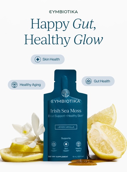 A clean, high-contrast product shot of Irish Sea Moss supplement packaging surrounded by fresh lemon slices and a vanilla flower.